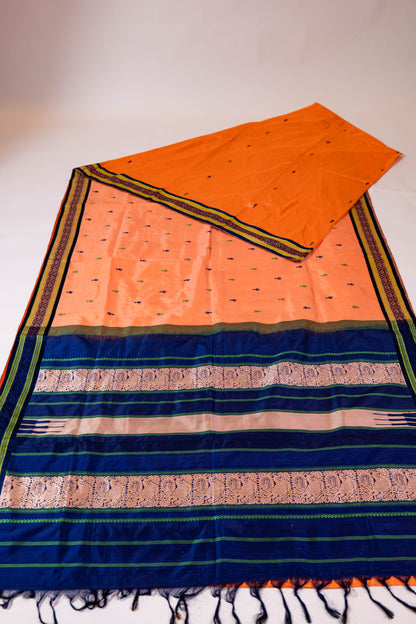 Naagchampa~ Peach Pure Silk Dharmavaram Saree with Navy Blue Borders – A Regal Weave from Andhra Pradesh