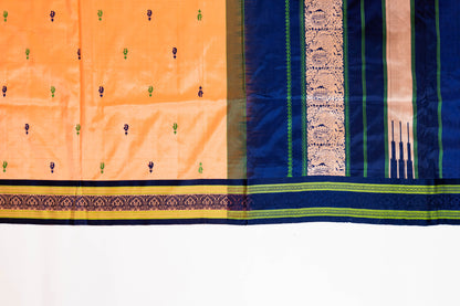 Naagchampa~ Peach Pure Silk Dharmavaram Saree with Navy Blue Borders – A Regal Weave from Andhra Pradesh